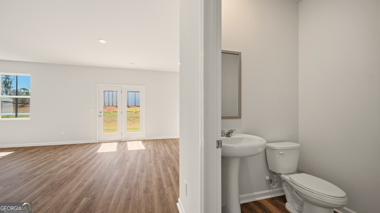 8578 Seabiscuit Road Lithonia, GA 30058 - Photo 5 of 30 a bathroom with a toilet and a sink