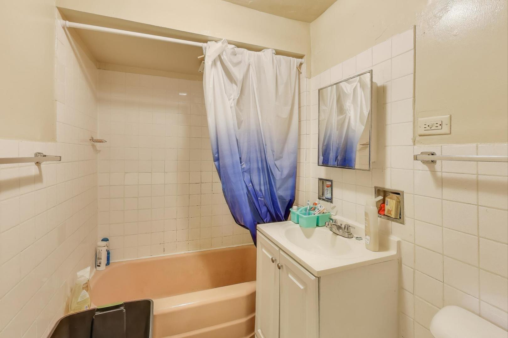4322 North Monticello Avenue Chicago, IL 60618 - Photo 11 of 37 a bathroom with a sink and a mirror