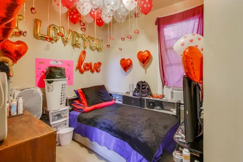 a bed room with a bed and a desk