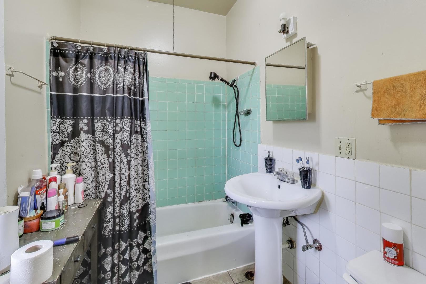 4322 North Monticello Avenue Chicago, IL 60618 - Photo 19 of 37 a bathroom with a sink toilet and shower