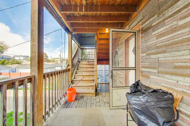 a view of balcony and wooden floor