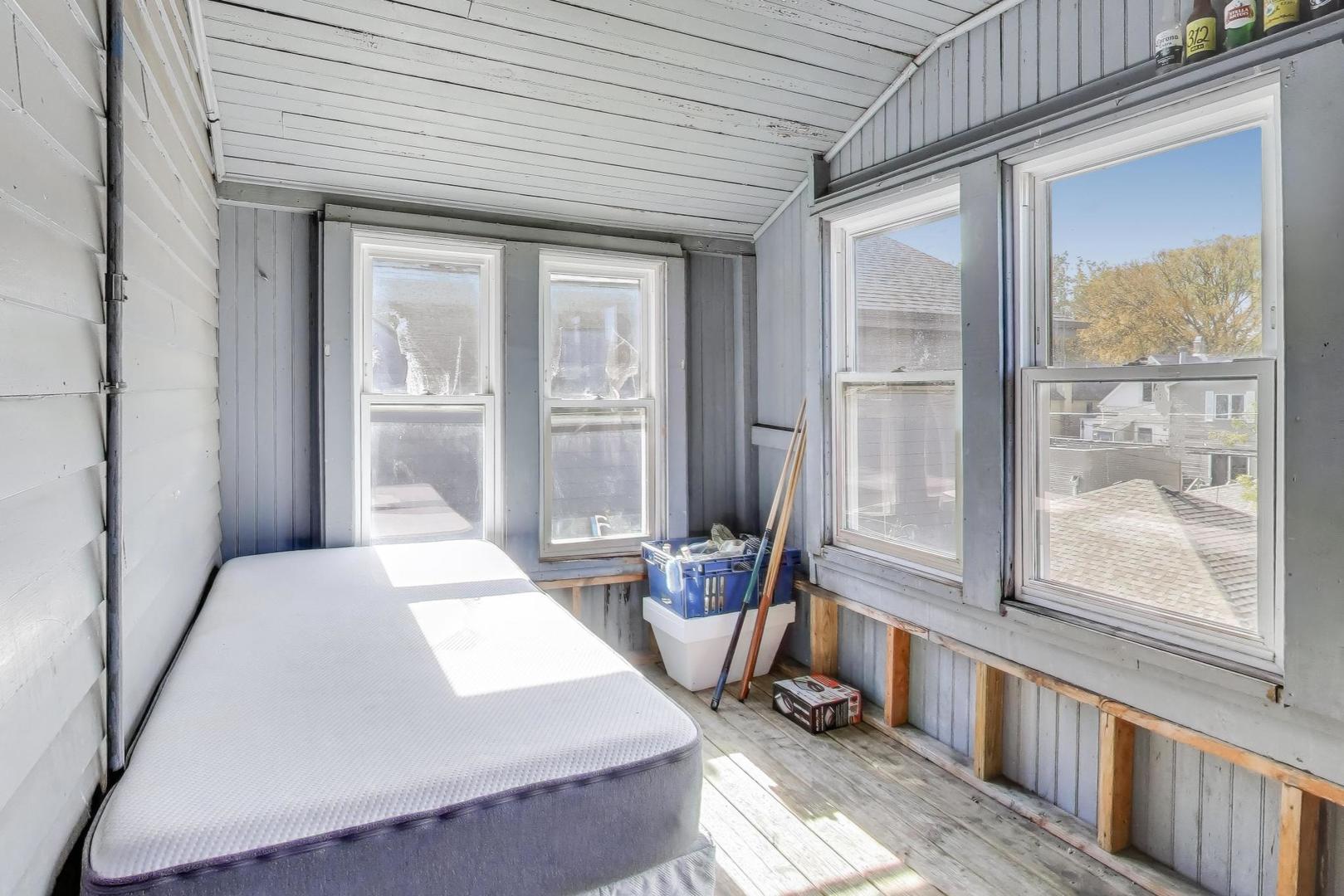 4322 North Monticello Avenue Chicago, IL 60618 - Photo 29 of 37 a room with furniture and a window