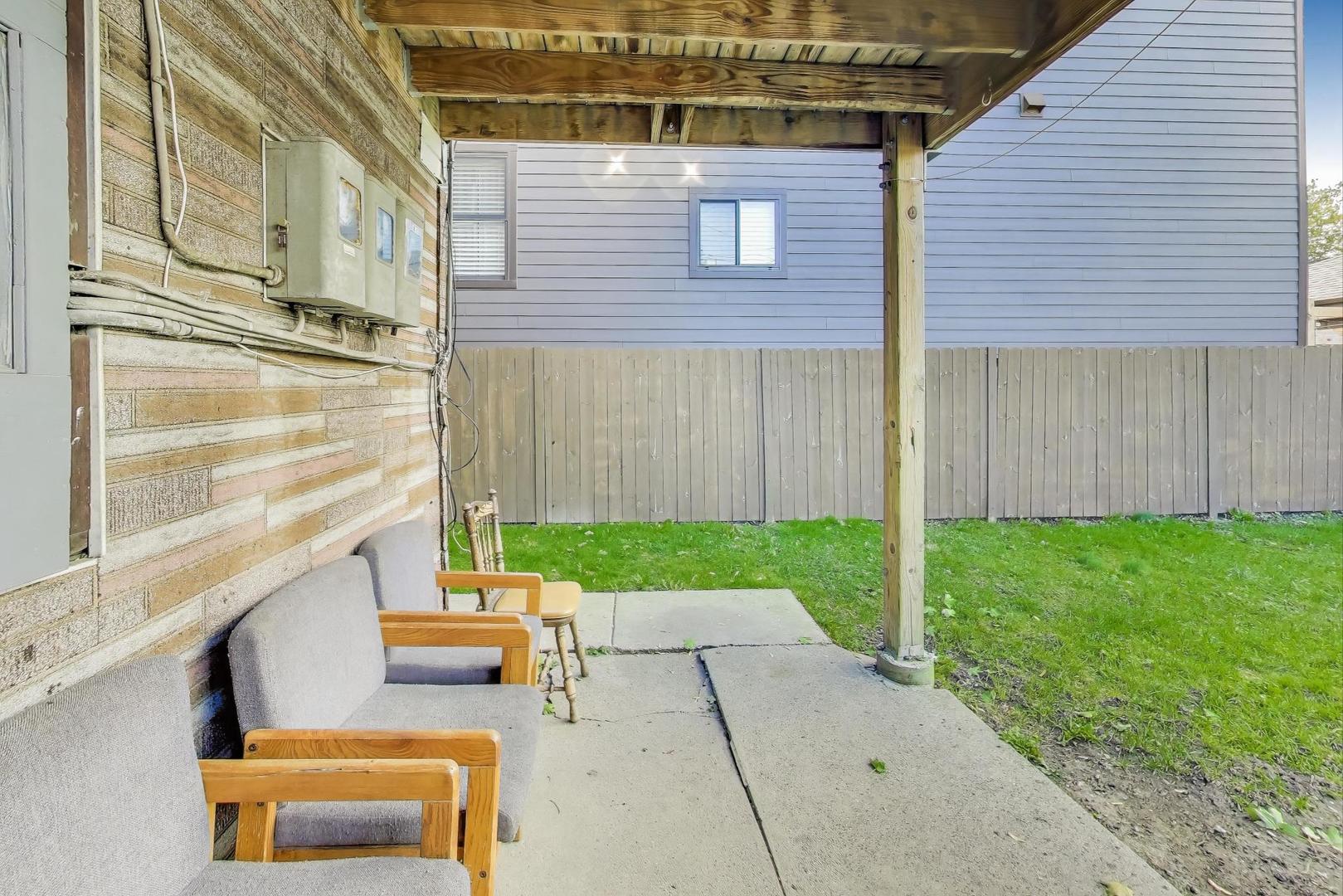 4322 North Monticello Avenue Chicago, IL 60618 - Photo 30 of 37 a backyard of a house with outdoor seating