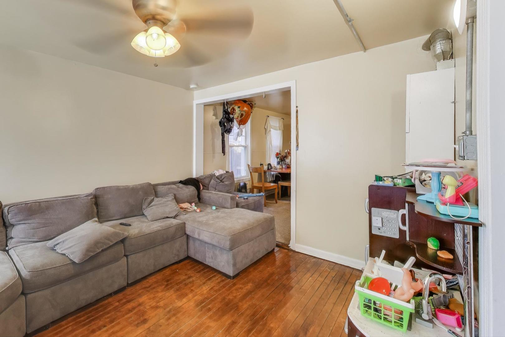 4322 North Monticello Avenue Chicago, IL 60618 - Photo 4 of 37 a living room with furniture and a window