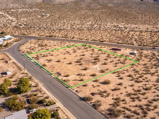 a view of an mountain with a mountain in the background