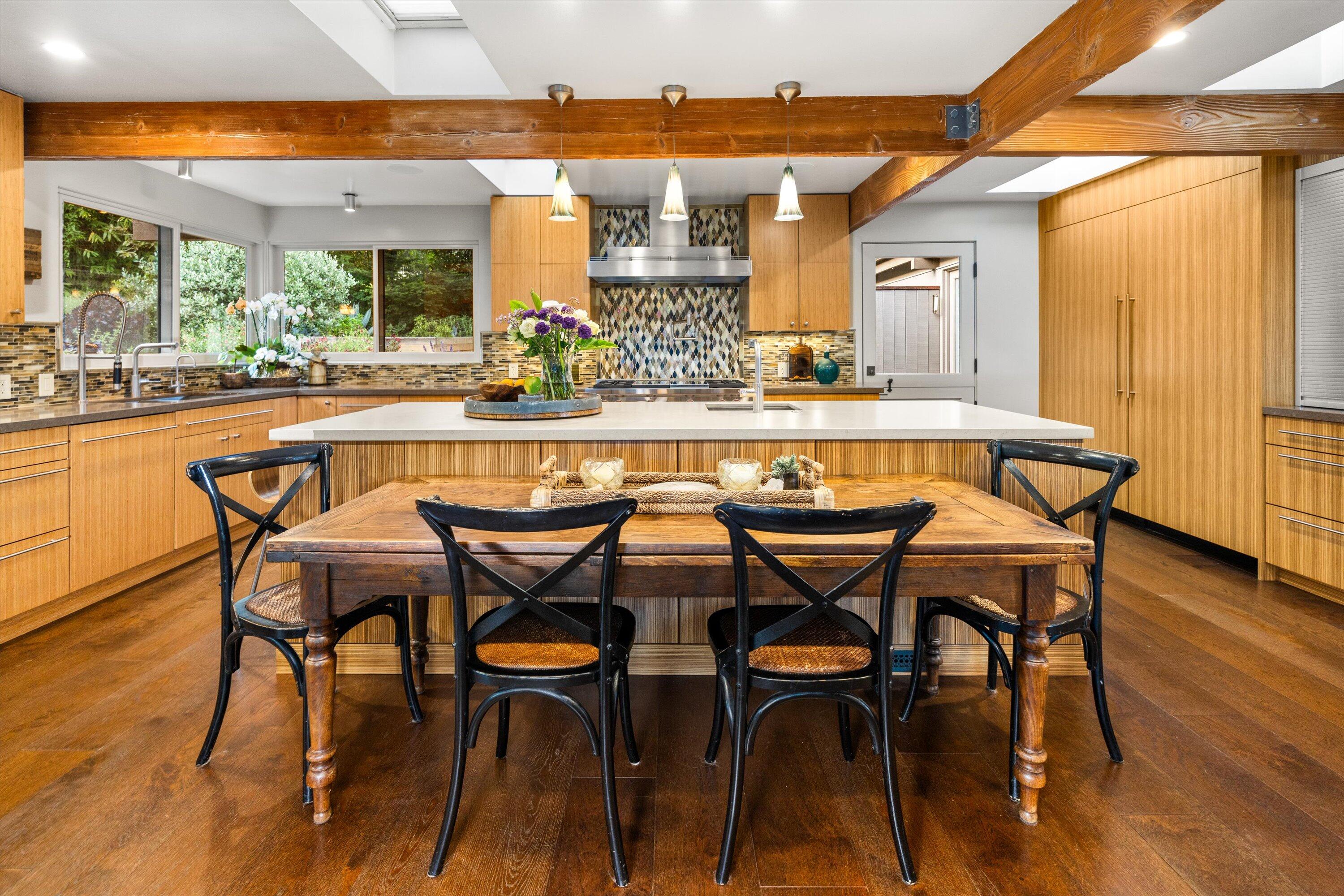 655 Oak Springs Lane Santa Barbara, CA 93108 - Photo 12 of 39 a dining area with furniture and wooden floor