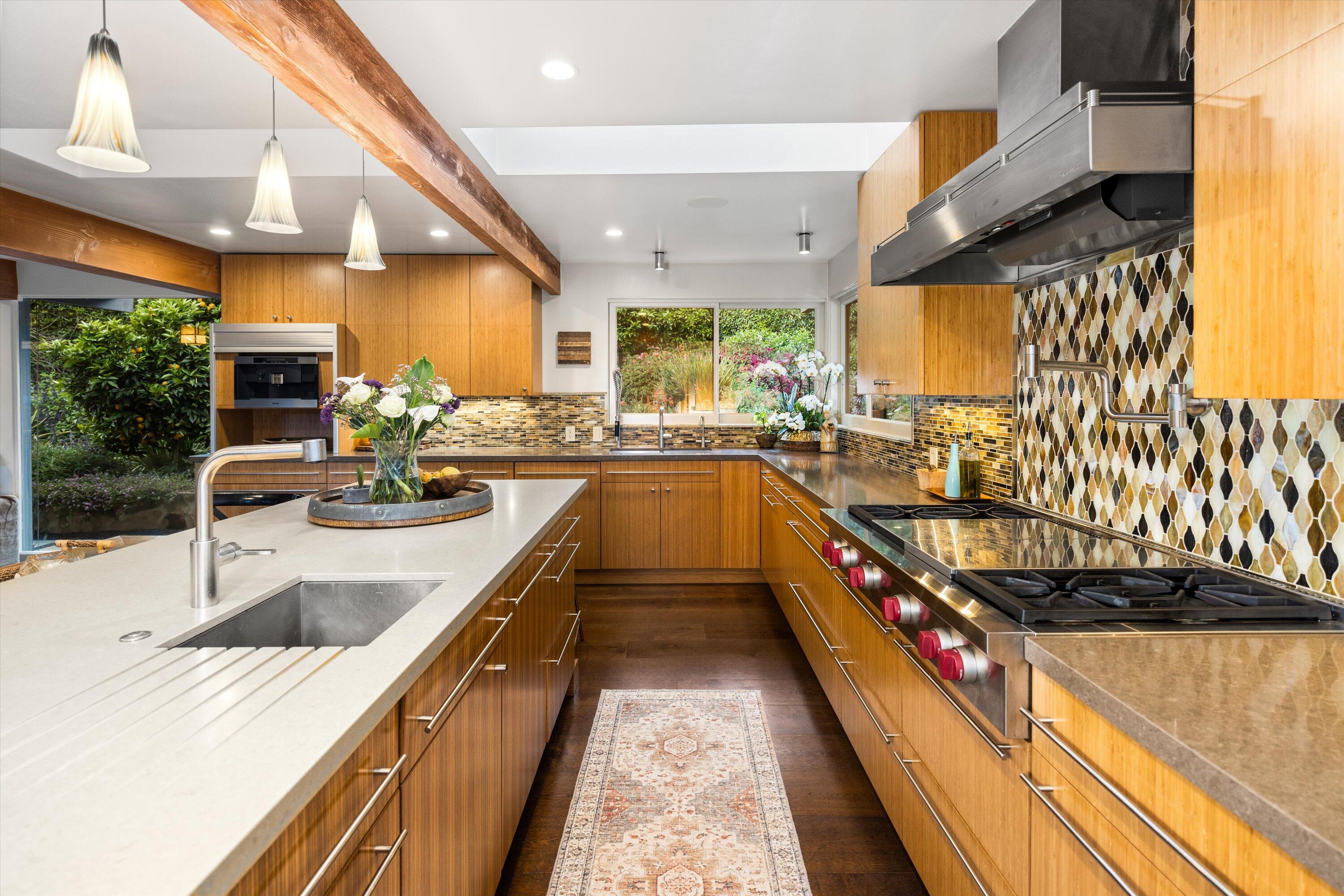 655 Oak Springs Lane Santa Barbara, CA 93108 - Photo 14 of 39 a large kitchen with stainless steel appliances kitchen island granite countertop a sink and cabinets