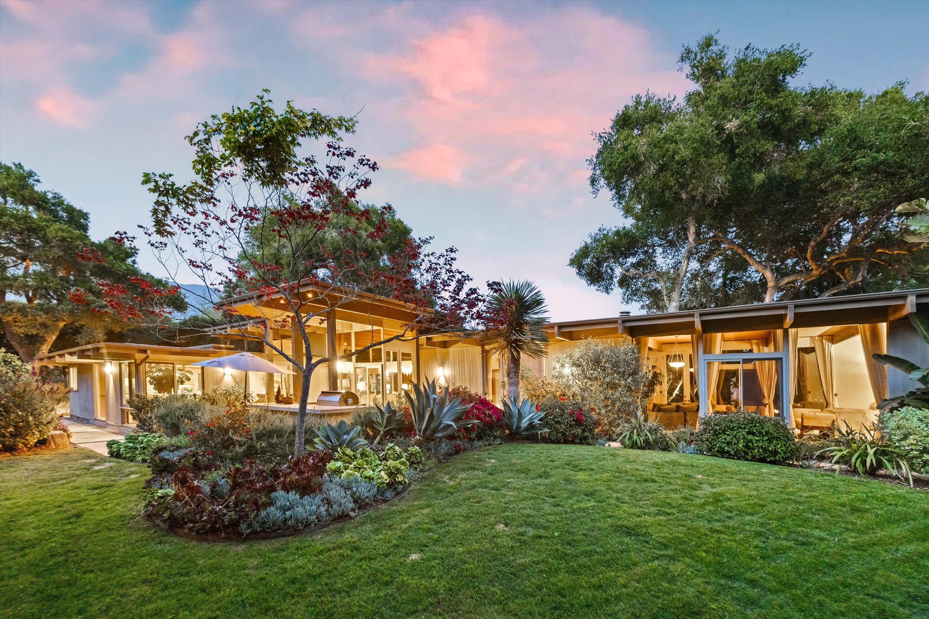 655 Oak Springs Lane Santa Barbara, CA 93108 - Photo 16 of 39 a view of a house with a big yard and potted plants