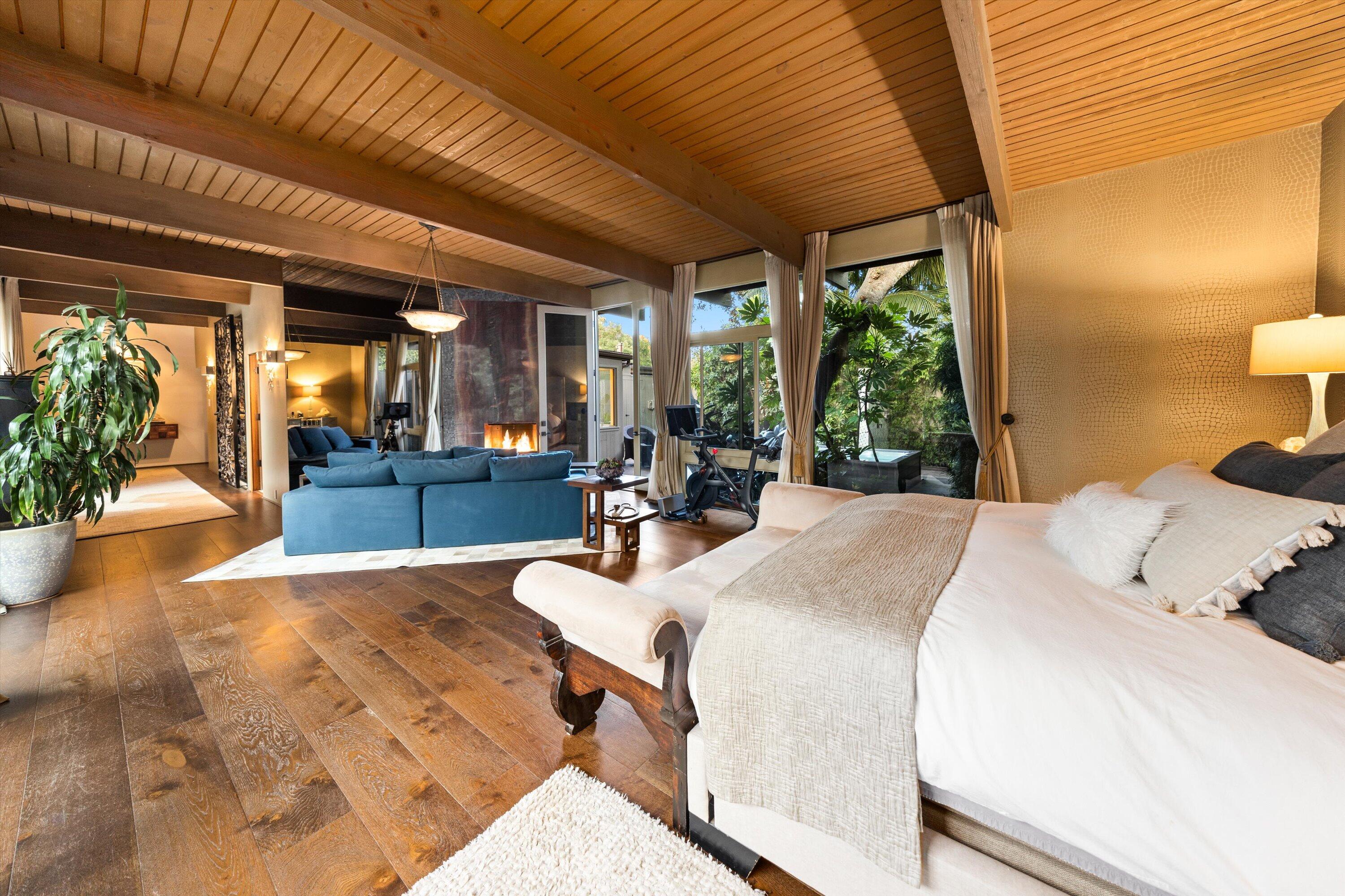 655 Oak Springs Lane Santa Barbara, CA 93108 - Photo 19 of 39 a large bedroom with wooden floor and furniture