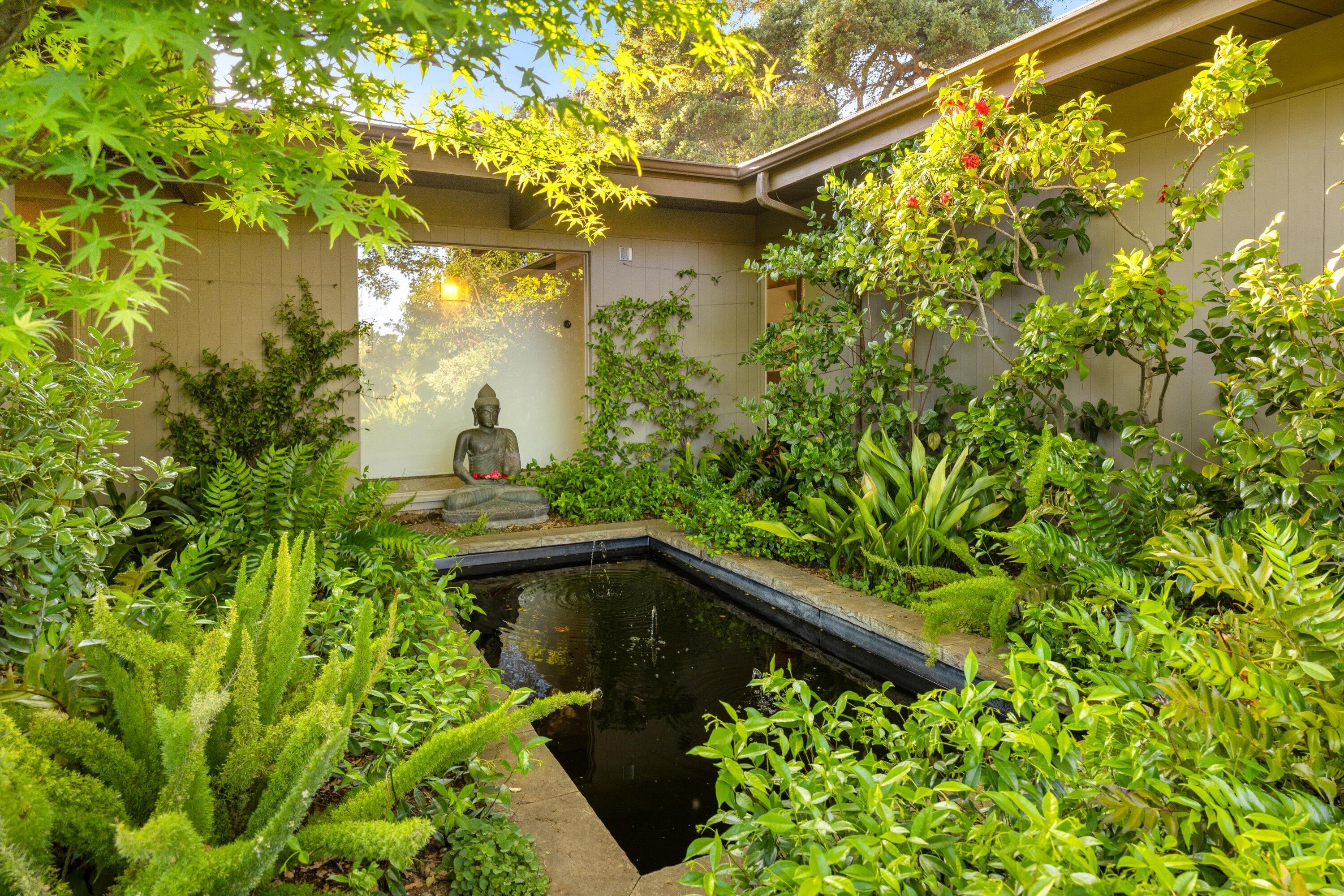 655 Oak Springs Lane Santa Barbara, CA 93108 - Photo 26 of 39 a backyard of a house with lots of green space and wooden floor