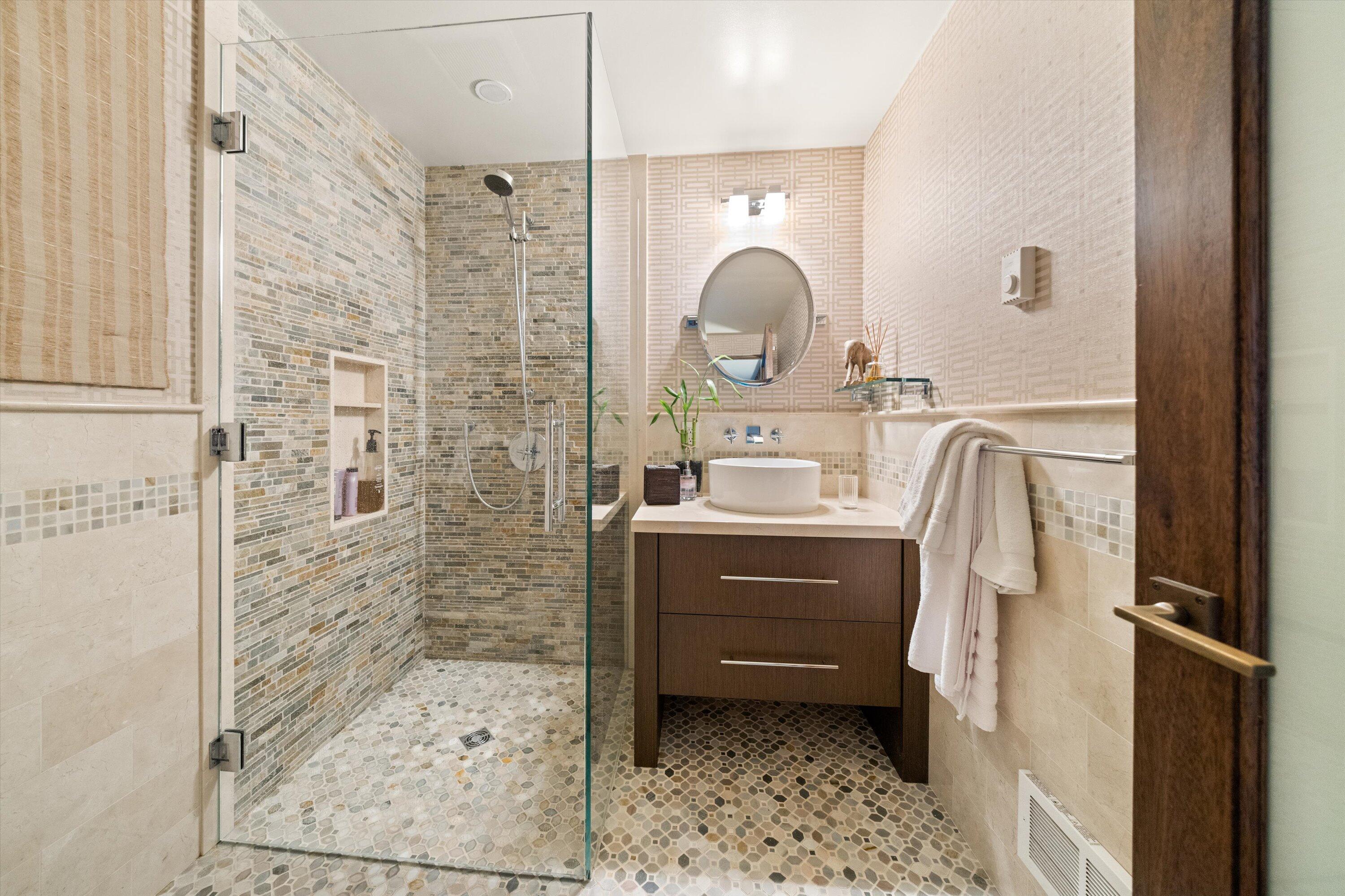 655 Oak Springs Lane Santa Barbara, CA 93108 - Photo 29 of 39 a bathroom with a sink a mirror and shower