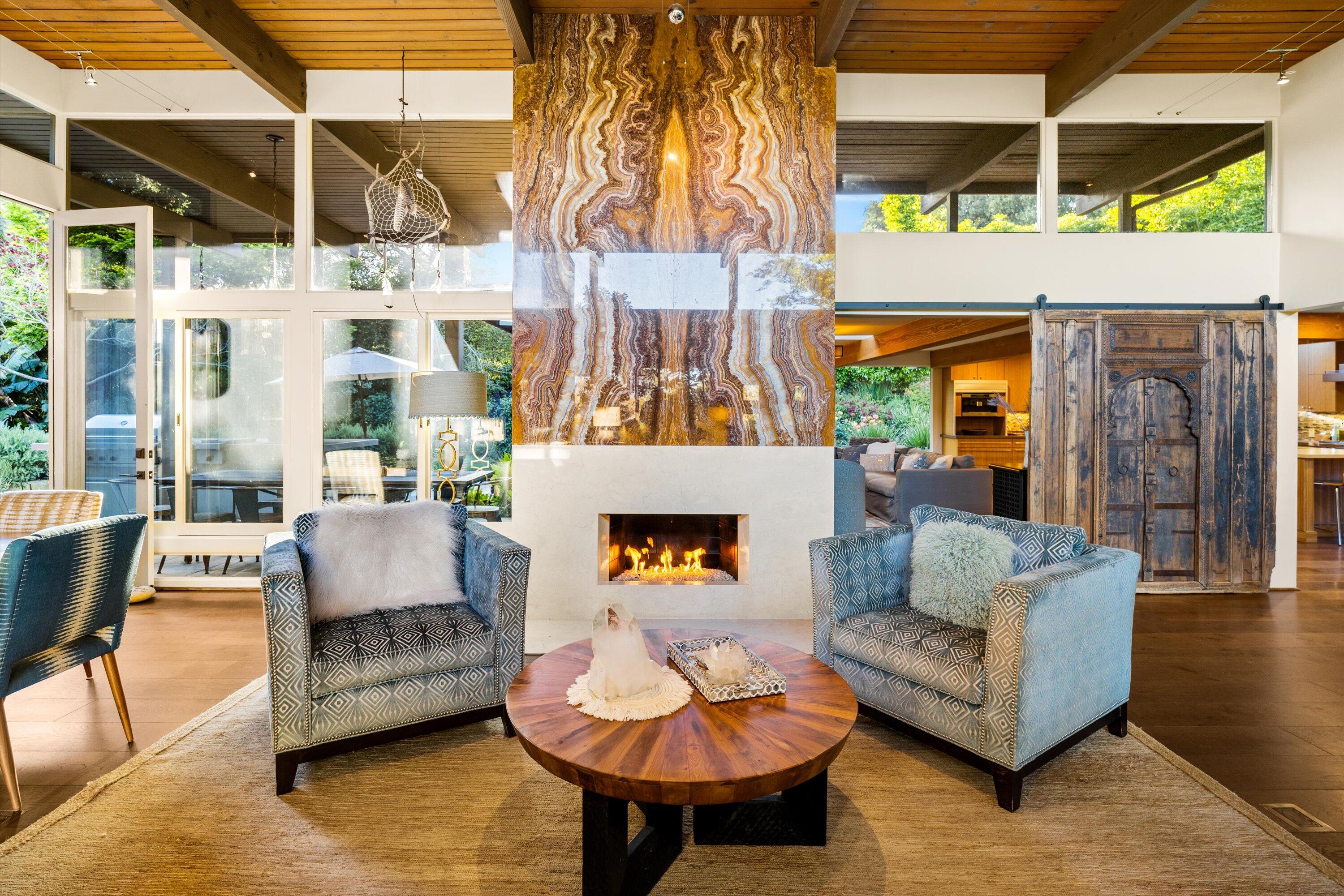 655 Oak Springs Lane Santa Barbara, CA 93108 - Photo 8 of 39 a living room with furniture and a fireplace