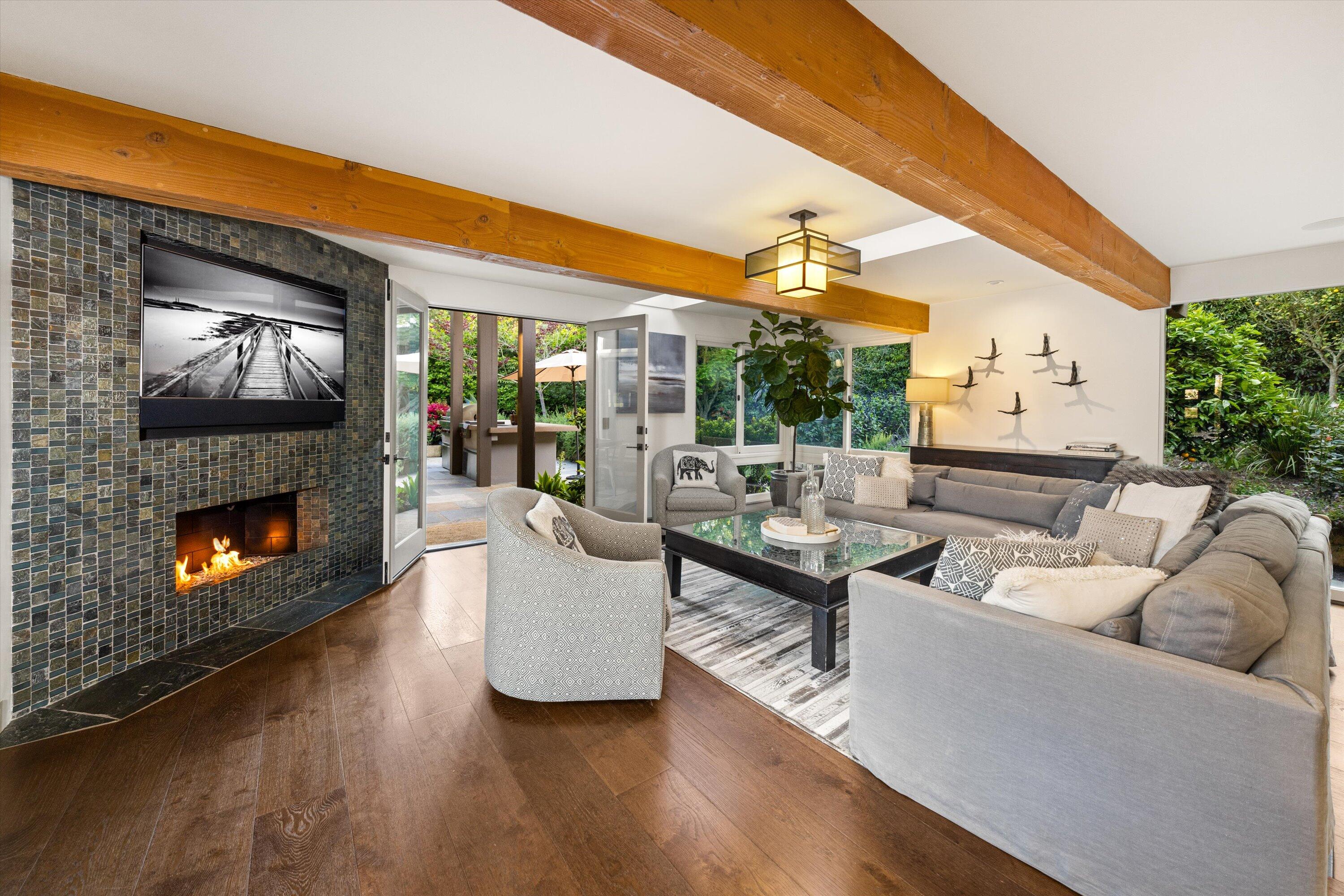 655 Oak Springs Lane Santa Barbara, CA 93108 - Photo 10 of 39 a living room with fireplace furniture and a flat screen tv