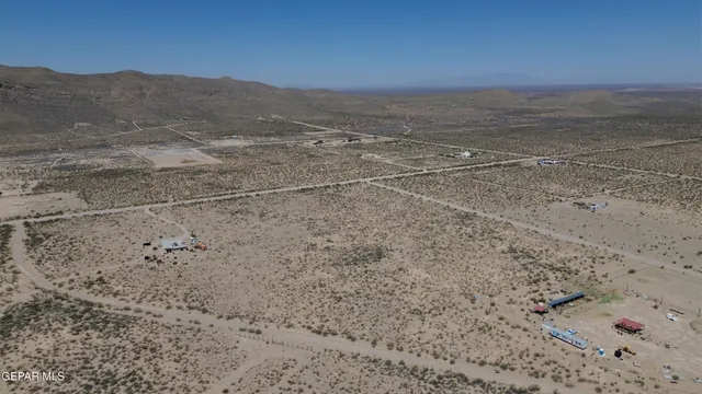 a view of an ocean beach and mountain