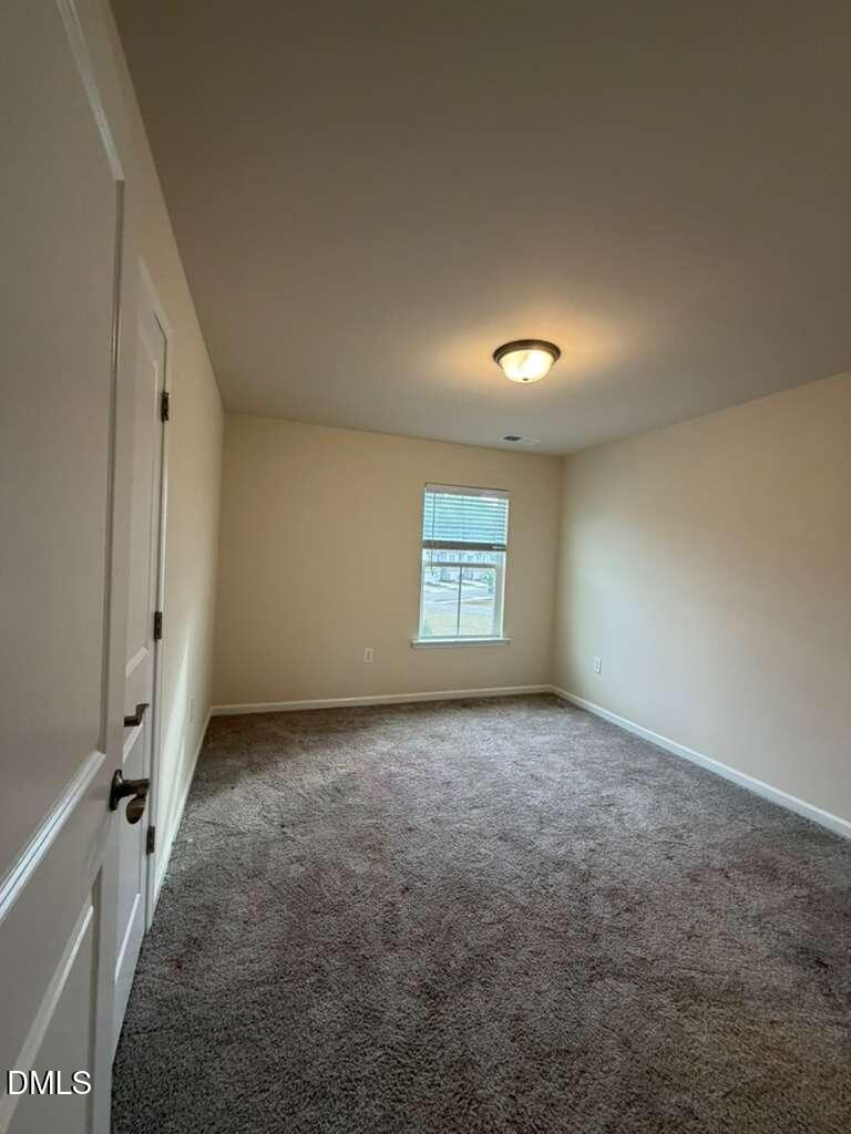336 Abbots Ml Drive Raleigh, NC 27603 - Photo 12 of 25 an empty room with windows
