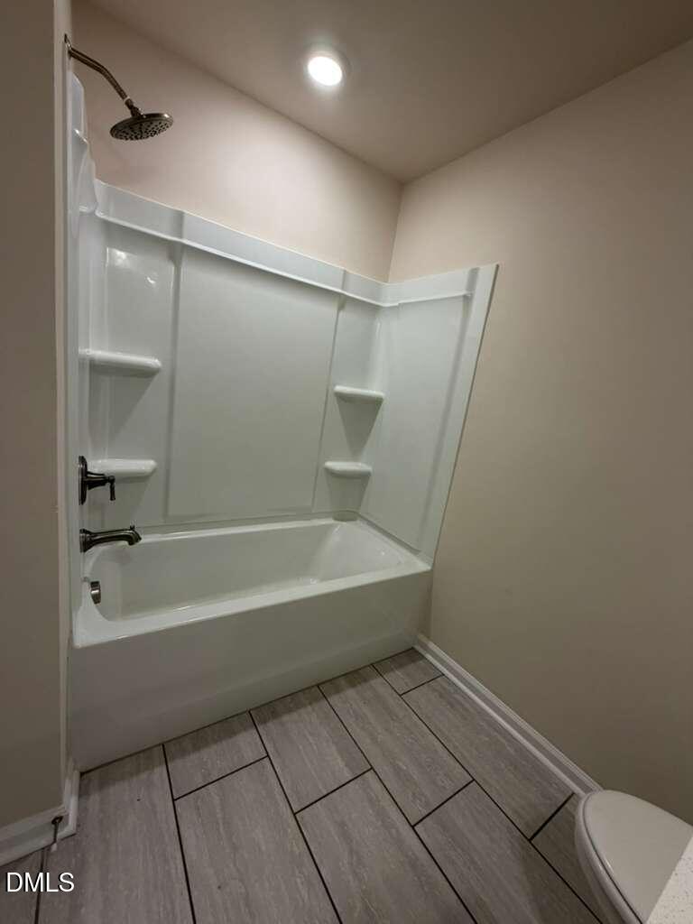 336 Abbots Ml Drive Raleigh, NC 27603 - Photo 16 of 25 a bathroom with a bathtub and a shower