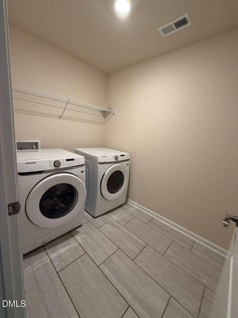 336 Abbots Ml Drive Raleigh, NC 27603 - Photo 21 of 25 a utility room with dryer and washer