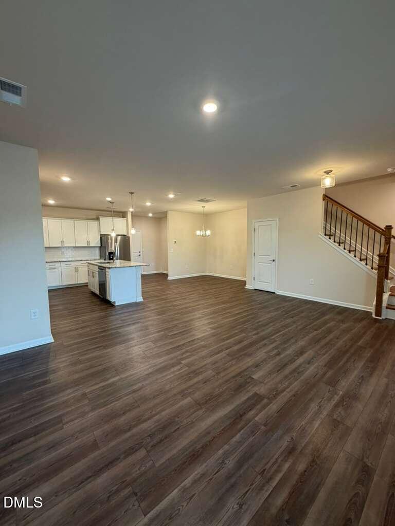 336 Abbots Ml Drive Raleigh, NC 27603 - Photo 5 of 25 a view of empty room with wooden floor