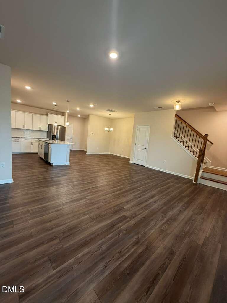 336 Abbots Ml Drive Raleigh, NC 27603 - Photo 6 of 25 a view of empty room with wooden floor