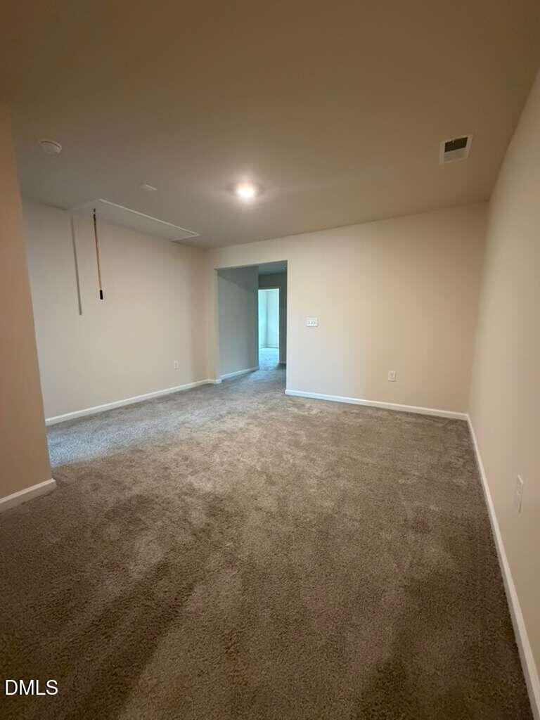 336 Abbots Ml Drive Raleigh, NC 27603 - Photo 10 of 25 an empty room with an entryway