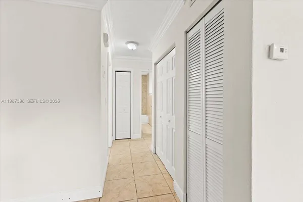 a view of a hallway with a white door