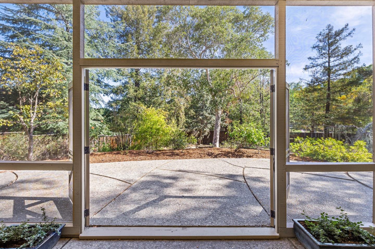 729 Tolman Drive Stanford, CA 94305 - Photo 17 of 48 a view of a room with a large window and wooden floor