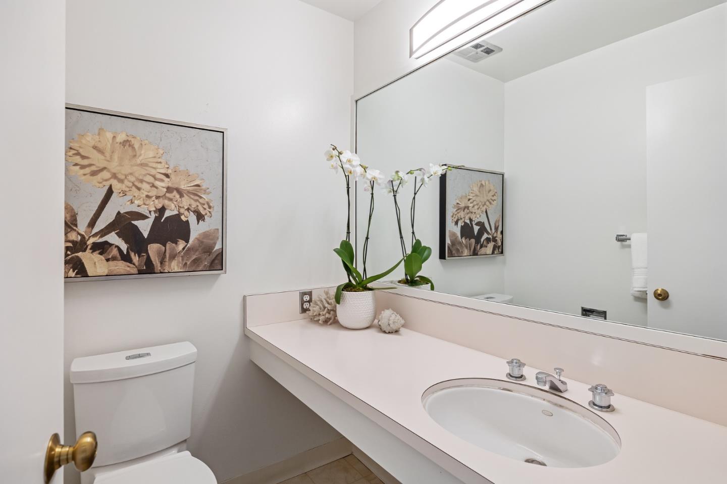729 Tolman Drive Stanford, CA 94305 - Photo 24 of 48 a bathroom with a toilet sink and mirror