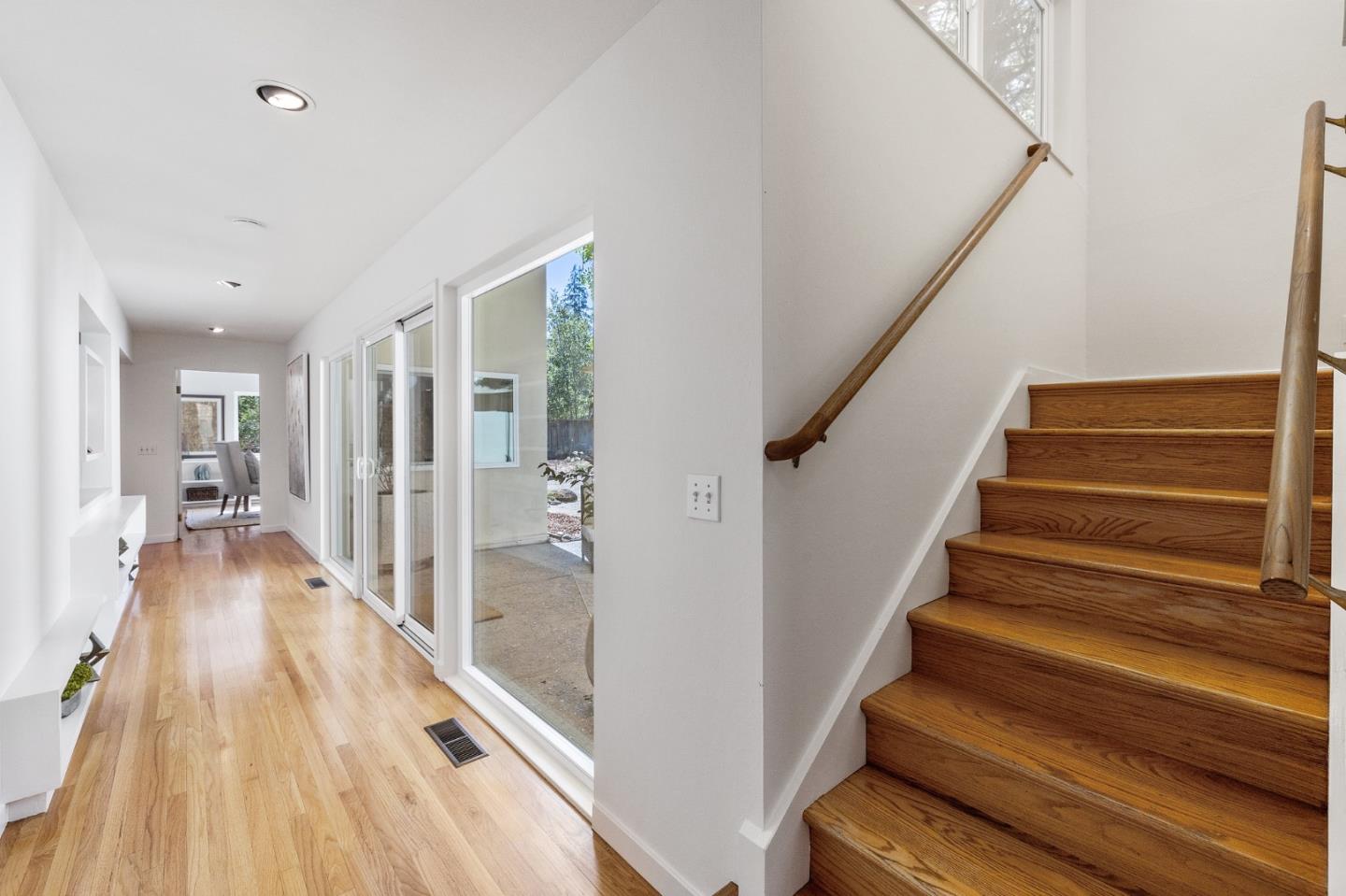 729 Tolman Drive Stanford, CA 94305 - Photo 25 of 48 a view of a hallway with wooden floor and staircase