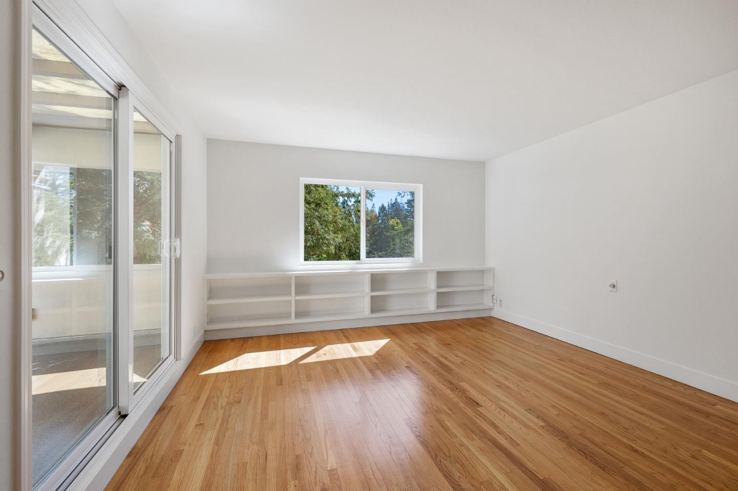 729 Tolman Drive Stanford, CA 94305 - Photo 26 of 48 a view of empty room with wooden floor and fan