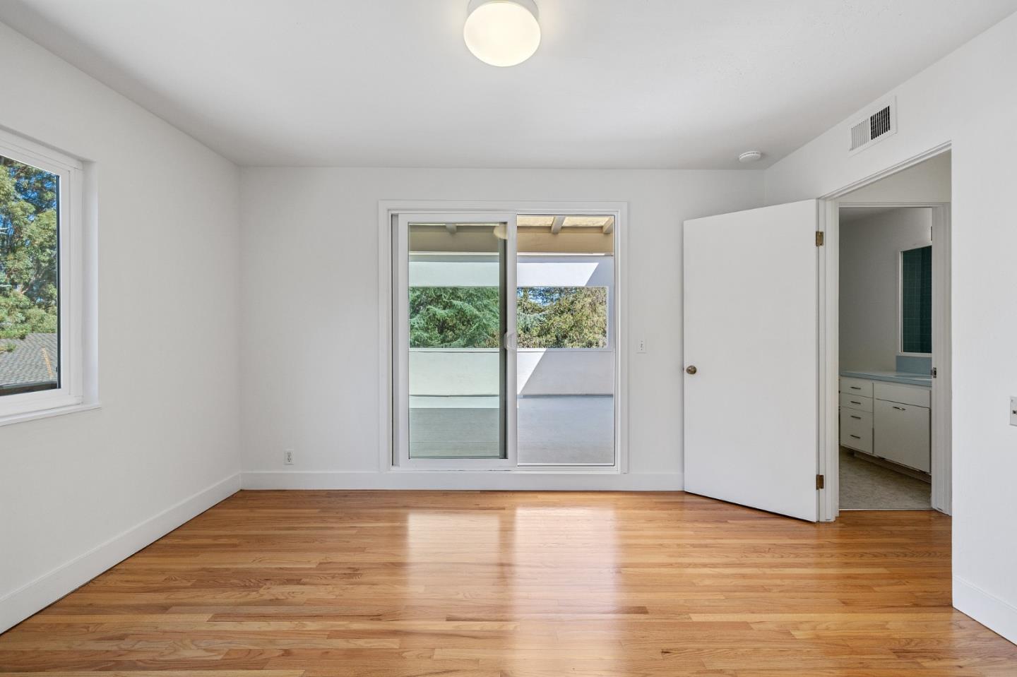 729 Tolman Drive Stanford, CA 94305 - Photo 34 of 48 a view of empty room with wooden floor and fan