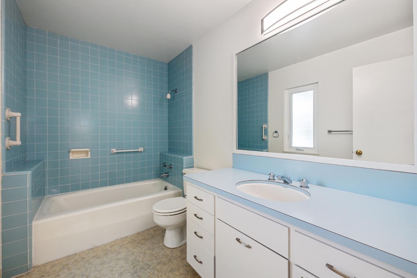 729 Tolman Drive Stanford, CA 94305 - Photo 36 of 48 a bathroom with a sink a toilet a mirror a bathtub and shower
