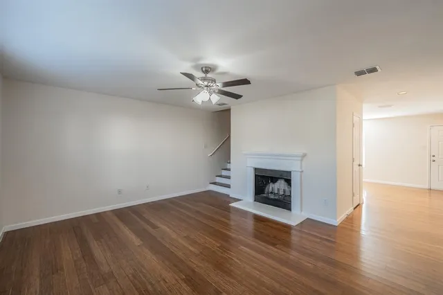 a view of a kitchen with an empty space and a fireplace