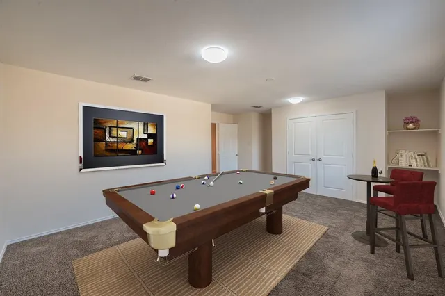 a kitchen with granite countertop a refrigerator and a sink