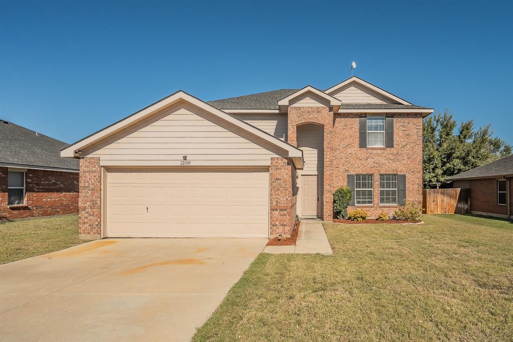 12109 Arbor Lake Road Rhome, TX 76078 - Photo 2 of 34 View of front of property with driveway and an attached garage