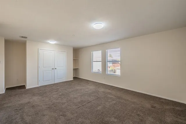 a room with furniture pool table and windows