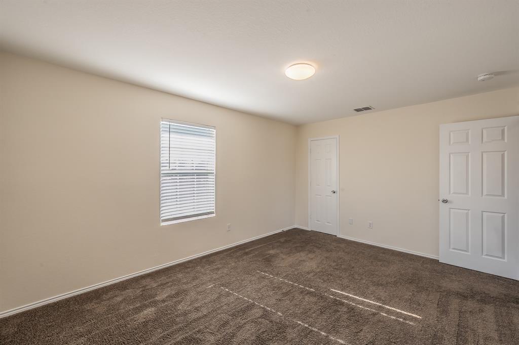 12109 Arbor Lake Road Rhome, TX 76078 - Photo 22 of 33 Spare room with dark carpet and baseboards