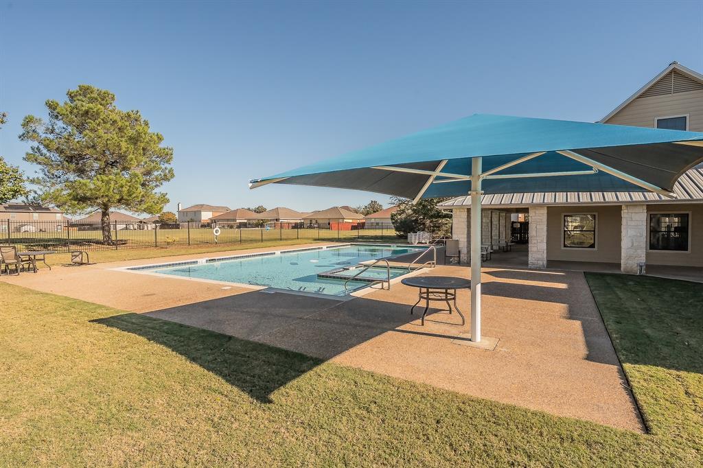 12109 Arbor Lake Road Rhome, TX 76078 - Photo 28 of 33 Community pool with a patio and a residential view