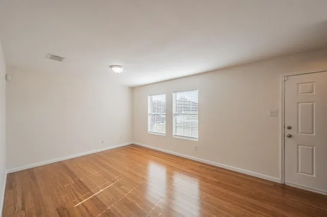 a view of a dining room with furniture wooden floor and a rug