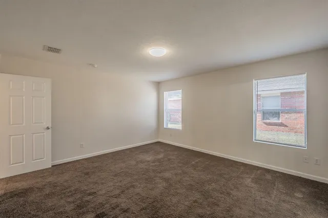 a bedroom with a bed and a closet