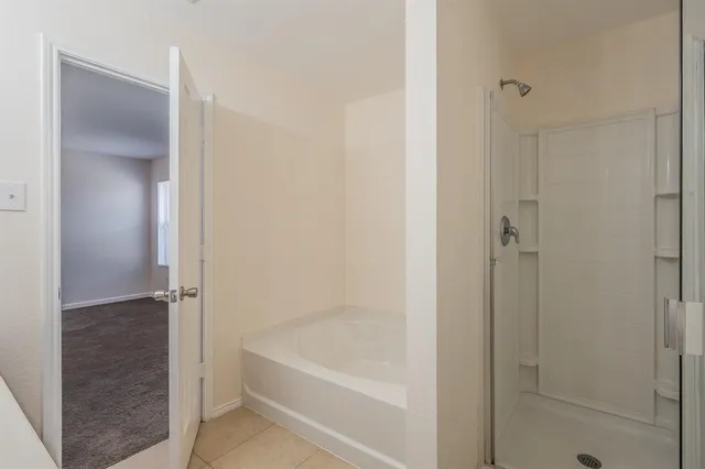a bathroom with a double vanity sink mirror and toilet