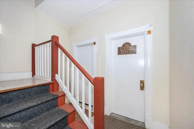 a living room with fireplace furniture and a window