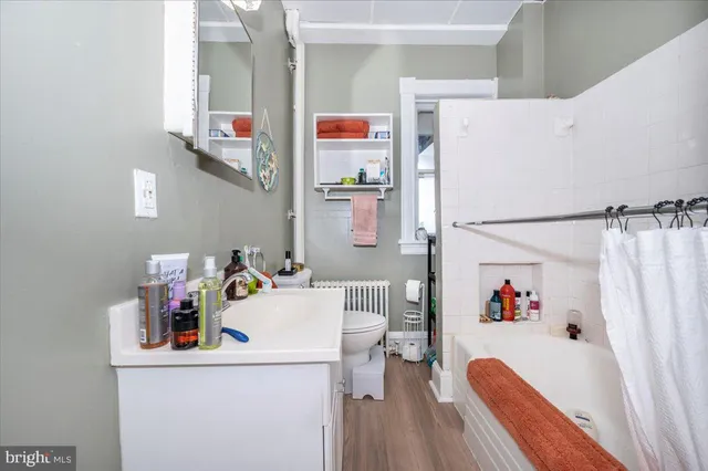 a kitchen with stainless steel appliances a refrigerator a stove a sink and a refrigerator