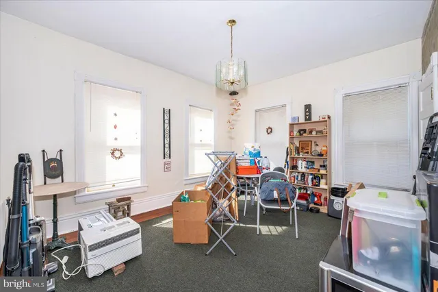a bedroom with a bed and flat screen tv