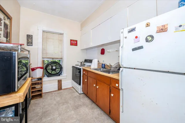 a bathroom with a bathtub sink and mirror