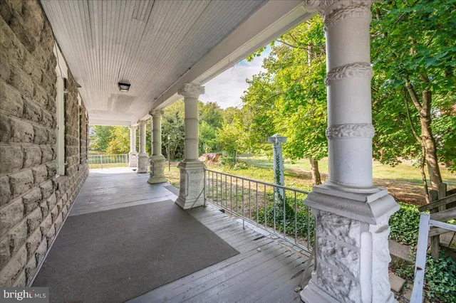 a bathroom with a sink mirror and a window