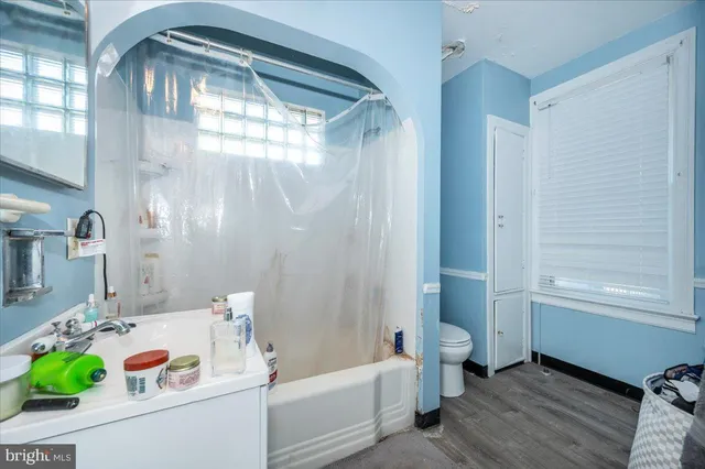 a room with refrigerator and washer