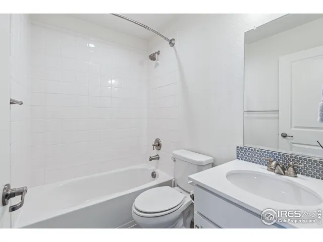 a bathroom with a sink a toilet and a bathtub