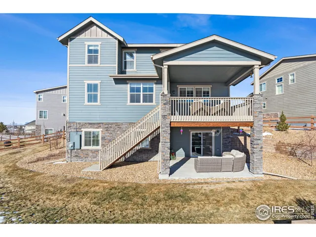 a view of a house with a balcony and door