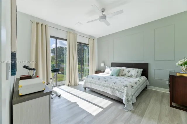 a bedroom with a large bed and a couch