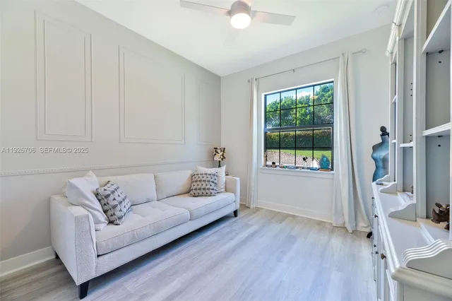 a living room with furniture and a window